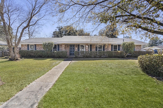 single story home featuring brick siding and a front yard