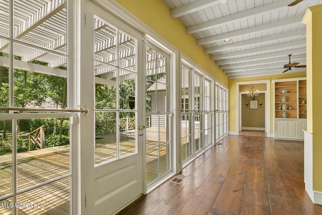 unfurnished sunroom featuring wood ceiling, beam ceiling, and ceiling fan with notable chandelier