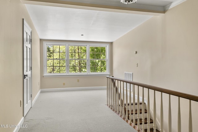 corridor featuring light colored carpet