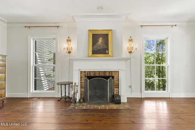 unfurnished living room with crown molding, a brick fireplace, and dark hardwood / wood-style flooring