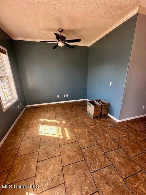 unfurnished room featuring a textured ceiling, ceiling fan, and ornamental molding