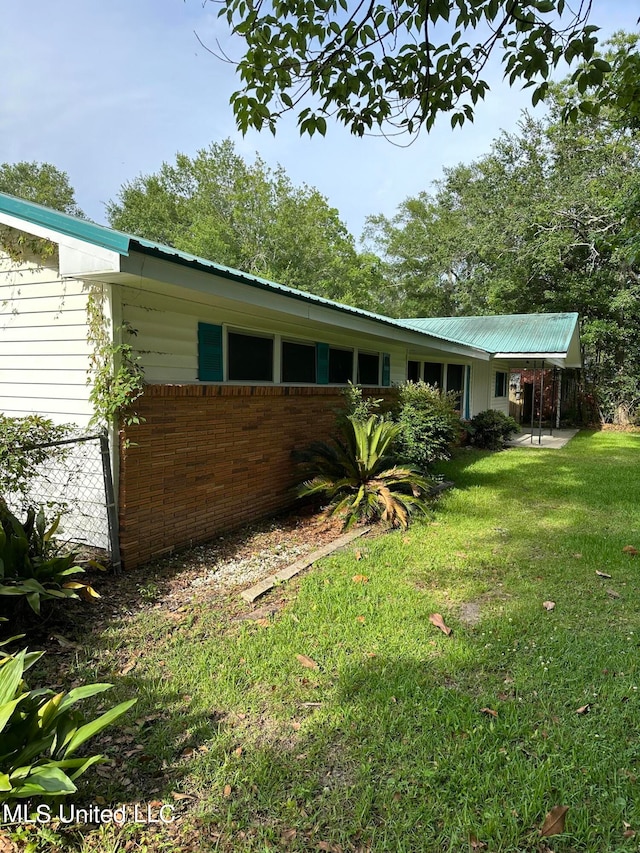 exterior space with a lawn