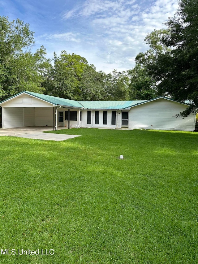 ranch-style house with a carport and a front lawn