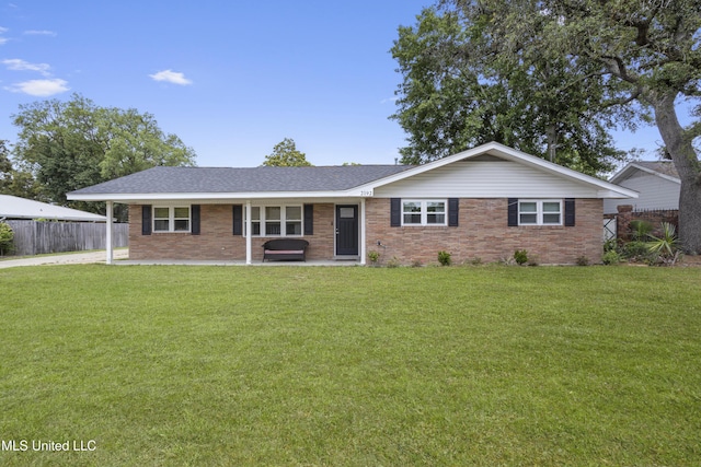 ranch-style home featuring fence, a patio area, a front lawn, and brick siding