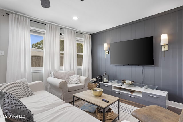 living area featuring light wood-style floors, baseboards, and recessed lighting