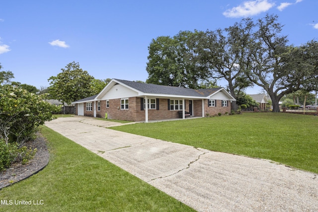 ranch-style house with brick siding, fence, driveway, and covered porch