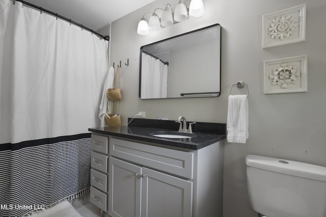 full bathroom featuring vanity and toilet