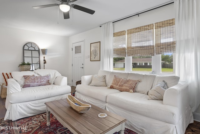 living room with ceiling fan and wood finished floors