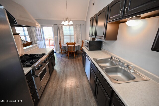 kitchen with lofted ceiling, dark wood-type flooring, sink, stainless steel appliances, and ventilation hood