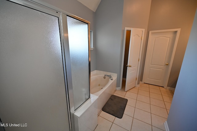 bathroom featuring tile patterned floors, lofted ceiling, and shower with separate bathtub