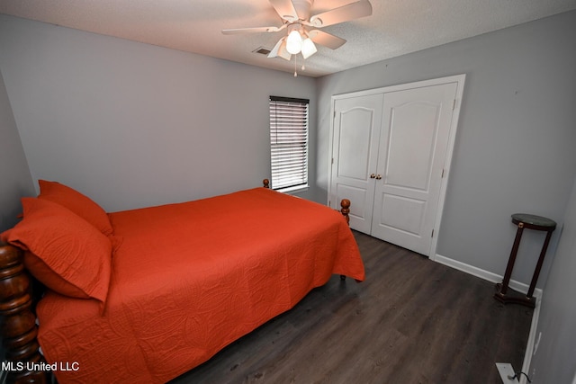 6126 Rolling Oaks Cv, Olive Branch, MS 38654 - bedroom featuring a closet, a ceiling fan, baseboards, and wood finished floors