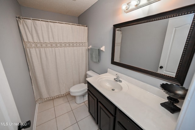 bathroom featuring curtained shower, a textured ceiling, toilet, tile patterned floors, and vanity