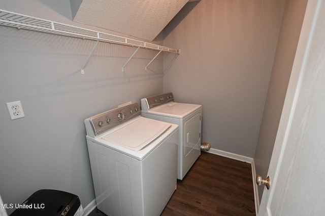 laundry area with dark wood-type flooring and separate washer and dryer