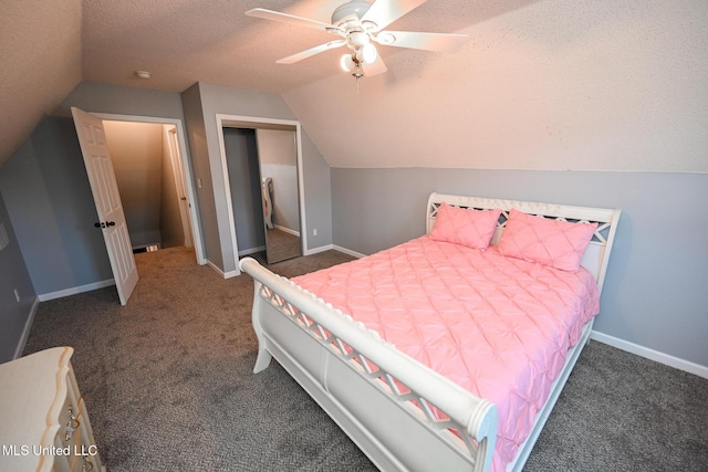 6126 Rolling Oaks Cv, Olive Branch, MS 38654 - carpeted bedroom with a closet, baseboards, vaulted ceiling, and a textured ceiling