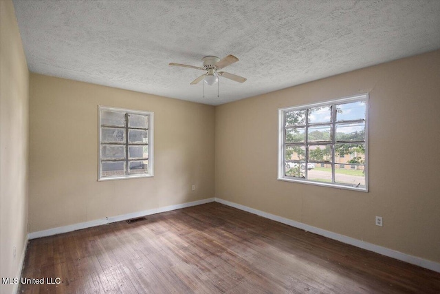 2862 Oak Forest Dr, Jackson, MS 39212 - unfurnished room featuring wood finished floors, baseboards, a ceiling fan, and a textured ceiling