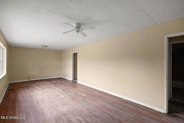 2862 Oak Forest Dr, Jackson, MS 39212 - spare room featuring wood finished floors, a ceiling fan, a textured ceiling, and baseboards