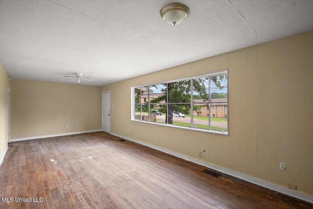 2862 Oak Forest Dr, Jackson, MS 39212 - unfurnished room with hardwood / wood-style flooring, ceiling fan, and baseboards