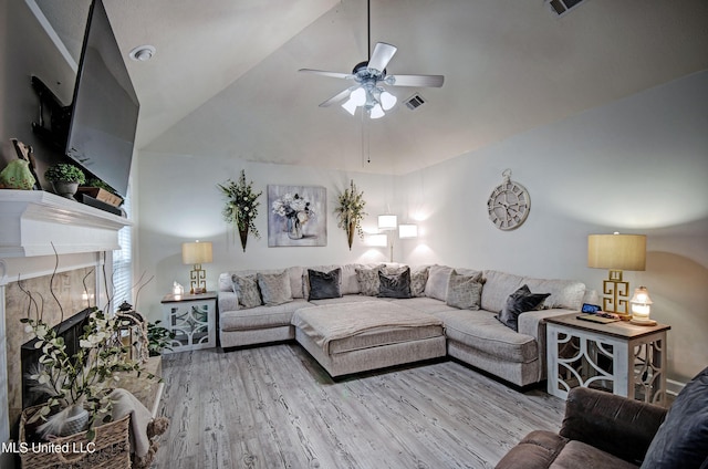 512 Sweetwater, Brandon, MS 39047 - living area featuring a ceiling fan, visible vents, vaulted ceiling, a high end fireplace, and wood finished floors