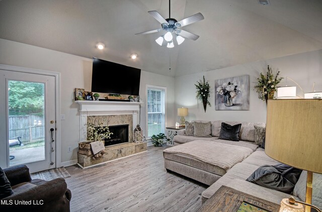 512 Sweetwater, Brandon, MS 39047 - living area featuring wood finished floors, ceiling fan, a fireplace, baseboards, and lofted ceiling