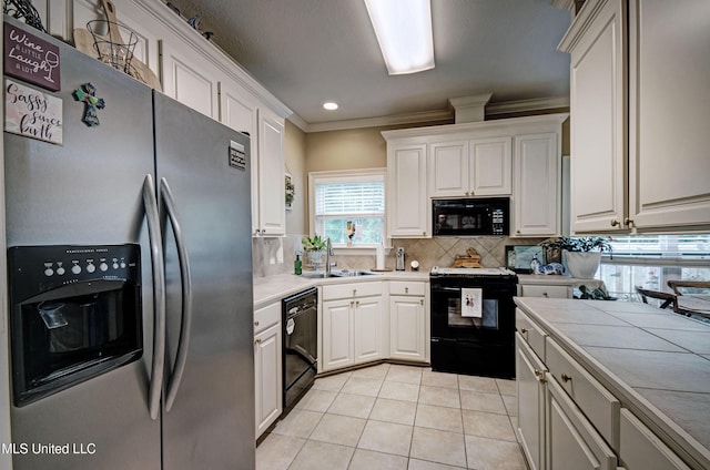 512 Sweetwater, Brandon, MS 39047 - kitchen featuring a sink, tasteful backsplash, crown molding, black appliances, and white cabinetry