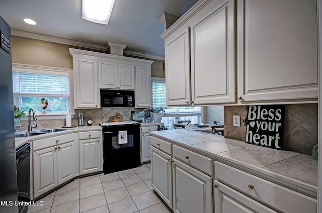 512 Sweetwater, Brandon, MS 39047 - kitchen featuring a sink, tile counters, light tile patterned floors, crown molding, and black appliances