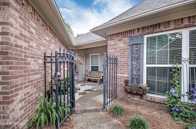 512 Sweetwater, Brandon, MS 39047 - exterior space with a gate, brick siding, and roof with shingles