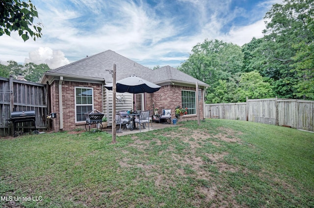 512 Sweetwater, Brandon, MS 39047 - rear view of house featuring a yard, a patio area, brick siding, and a fenced backyard