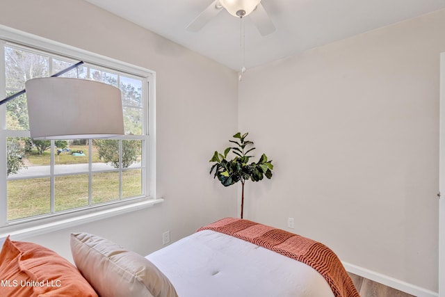 bedroom featuring ceiling fan and wood-type flooring