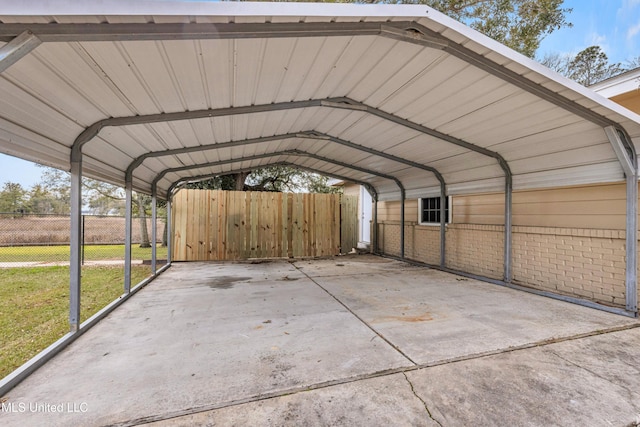 view of parking / parking lot featuring a carport