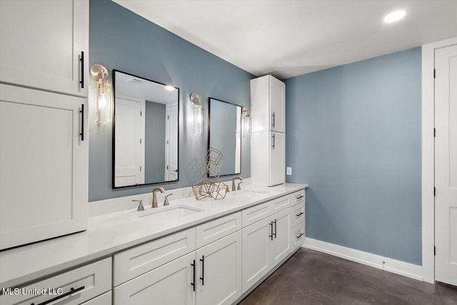 bathroom featuring concrete floors and vanity