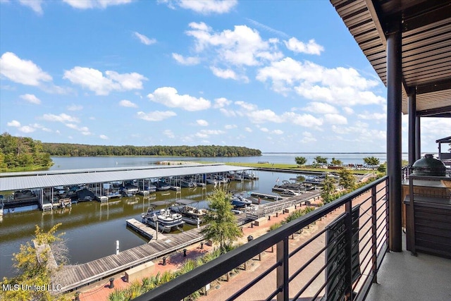 balcony with a dock and a water view