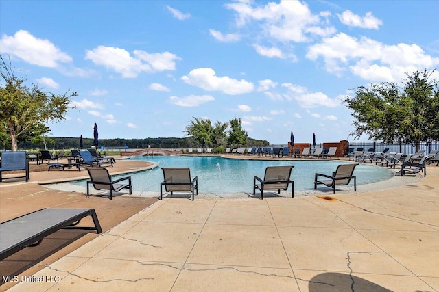 view of pool featuring a patio