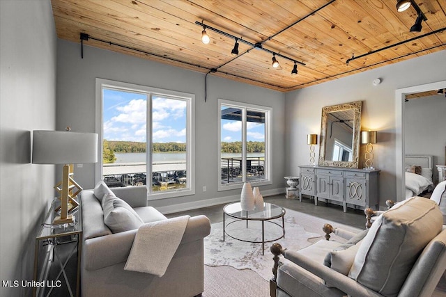 living room featuring track lighting, wood ceiling, and a water view