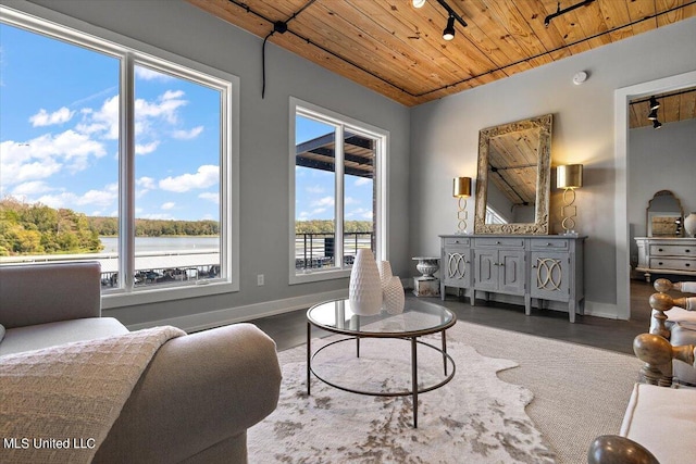 sitting room with wood ceiling and a water view