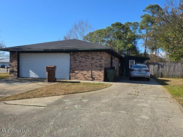 view of property exterior featuring a garage