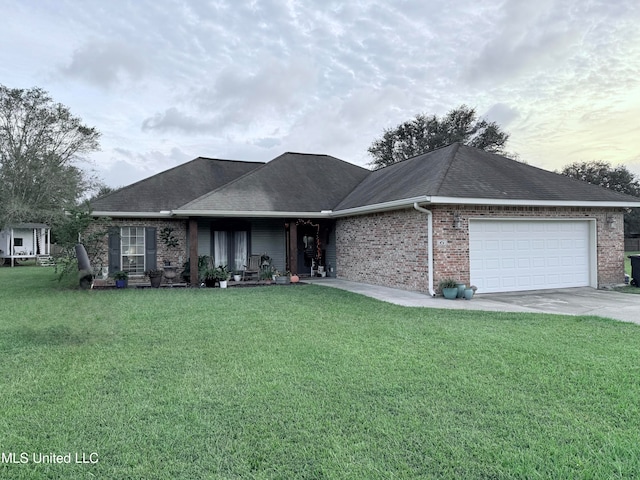 view of front of house with a garage and a front yard