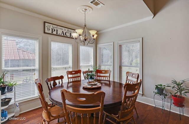 dining area featuring baseboards, visible vents, ornamental molding, dark wood-style flooring, and a notable chandelier