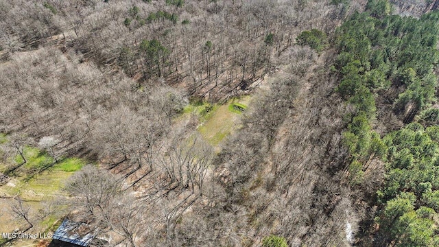 birds eye view of property with a wooded view