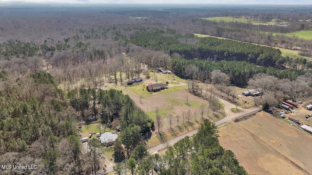 drone / aerial view with a rural view and a view of trees