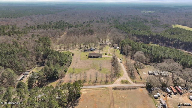 aerial view featuring a forest view and a rural view