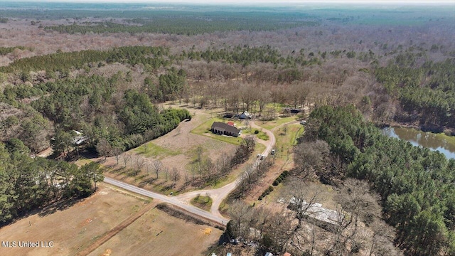 aerial view featuring a water view and a view of trees