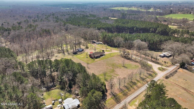 bird's eye view featuring a rural view and a wooded view