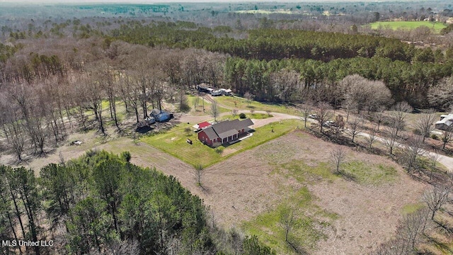 bird's eye view featuring a forest view and a rural view