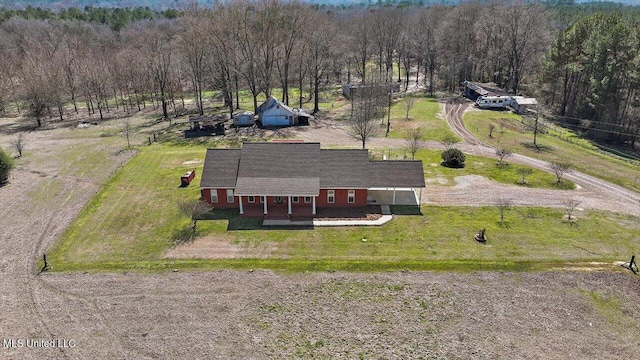 birds eye view of property with a rural view and a view of trees