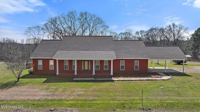 view of front of property with a porch, driveway, a shingled roof, and a front lawn