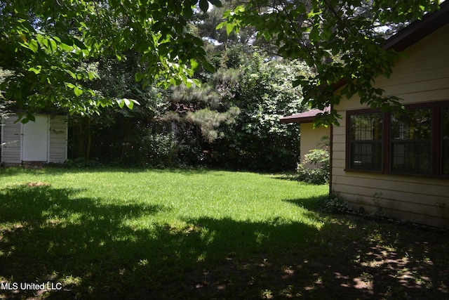 236 E Moon St, Ridgeland, MS 39157 - view of green lawn with a storage shed