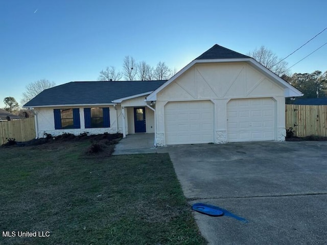 single story home with a front lawn and a garage