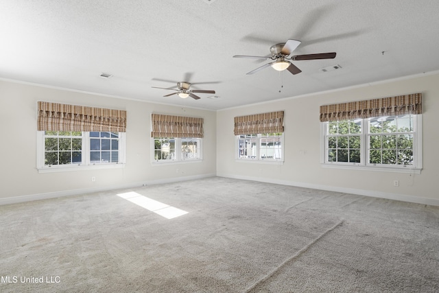 carpeted empty room with a textured ceiling, ceiling fan, and crown molding