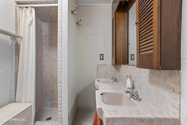 bathroom with sink, decorative backsplash, and a shower with curtain