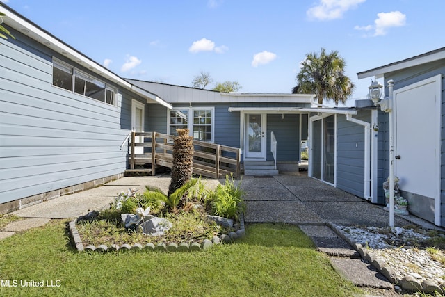 exterior space featuring a yard and a wooden deck